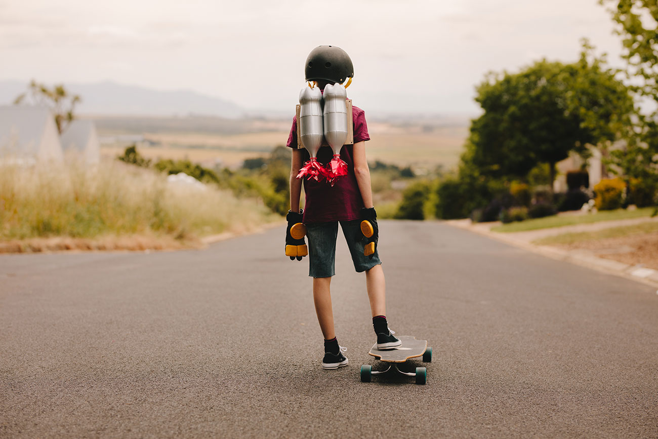 Kid with jetpack and skateboard