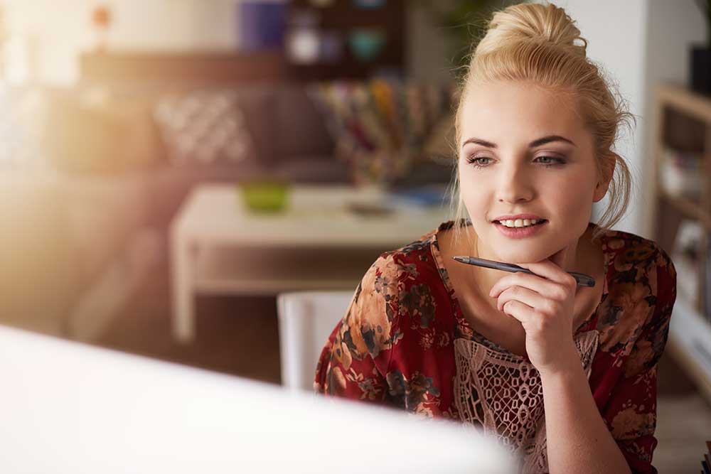 Female entrepreneur looking at laptop