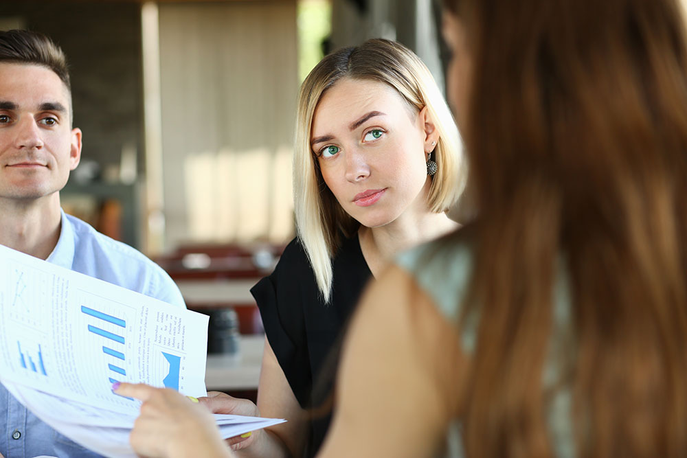 young colleagues looking over documents