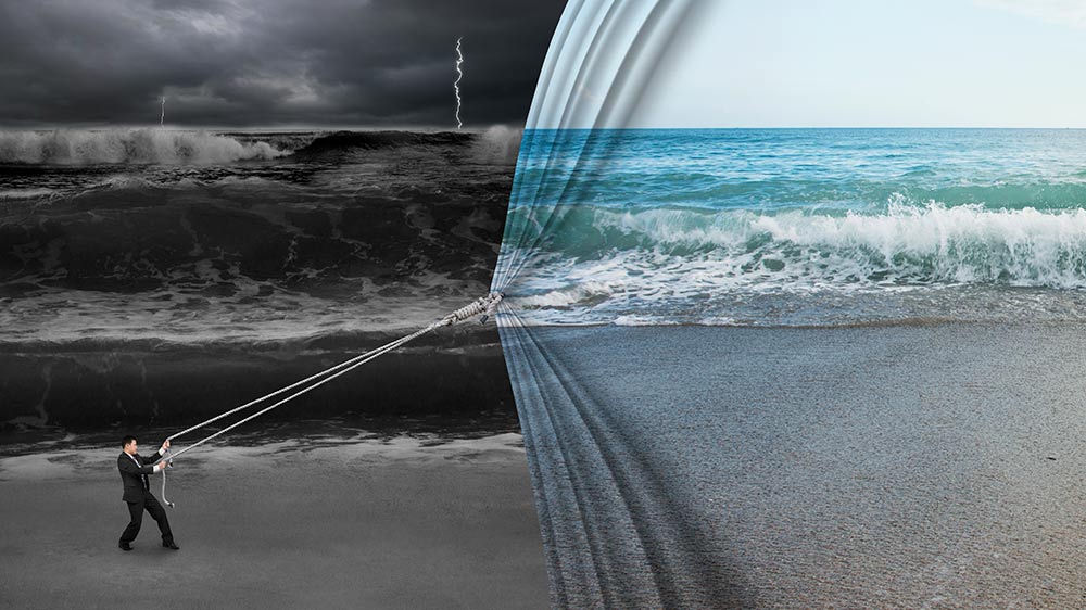 businessman pulling calm seas scene over stormy scene