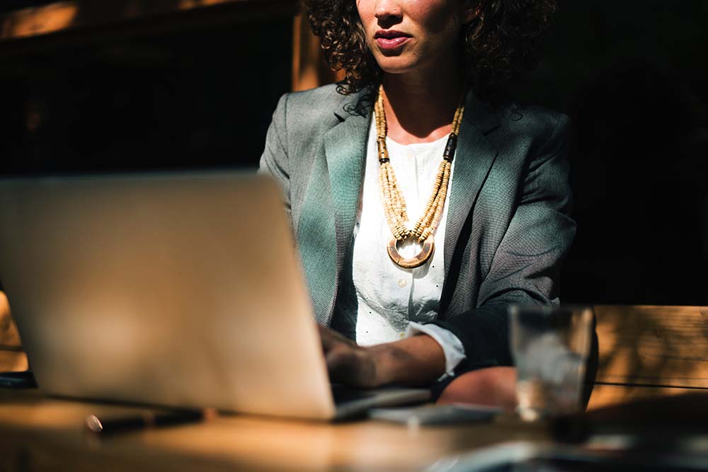 Businesswoman at laptop - women entrepreneurs