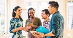 group of immigrant founders and young professionals talking